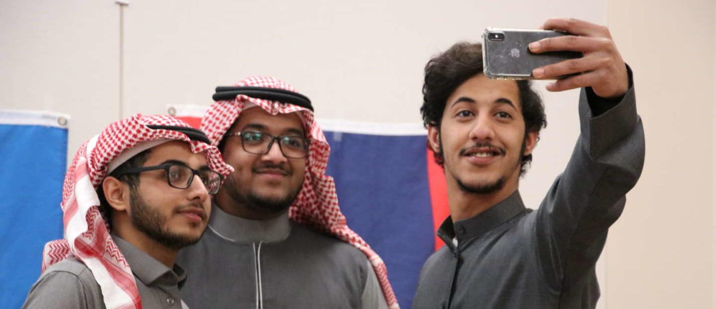 A group of students pose for a selfie during international week